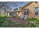 Charming patio with outdoor seating, perfect for enjoying the backyard and the home's brick facade at 6140 Buttonwood Dr, Noblesville, IN 46062