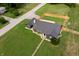 Aerial view of home with fenced yard and lots of green space at 6555 Michigan Rd, Indianapolis, IN 46268