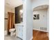 Bathroom featuring a subway tile shower and modern vanity with a round mirror at 6555 Michigan Rd, Indianapolis, IN 46268