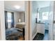 Primary suite showing the bedroom with a view into the Primary bath at 6555 Michigan Rd, Indianapolis, IN 46268