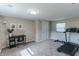 Bonus room featuring new carpet, a small desk and treadmill at 6555 Michigan Rd, Indianapolis, IN 46268