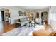 Inviting living room with hardwood floors and large sectional couch at 6555 Michigan Rd, Indianapolis, IN 46268