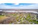 Breathtaking aerial view showcasing a community nestled along the serene lakefront, with lush landscapes and scenic views at 7002 Oakbay Cir, Noblesville, IN 46062