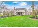 An expansive backyard with a screened-in porch, deck, and lush lawn provides a perfect outdoor retreat at 7002 Oakbay Cir, Noblesville, IN 46062