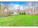 Spacious backyard features a well-manicured lawn and mature trees, creating a serene and private outdoor space at 7002 Oakbay Cir, Noblesville, IN 46062