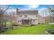 View of the back of a house featuring screened in porch and wooden deck at 7002 Oakbay Cir, Noblesville, IN 46062