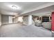 Large finished basement offers ample space for recreation and relaxation with neutral carpet at 7002 Oakbay Cir, Noblesville, IN 46062