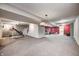 Spacious finished basement with exercise equipment and plenty of open floor space at 7002 Oakbay Cir, Noblesville, IN 46062