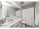 Bright bathroom with a vanity, large mirror, and a shower with a white curtain at 7002 Oakbay Cir, Noblesville, IN 46062