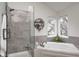 Bathroom featuring standalone shower, large bathtub and natural light at 7002 Oakbay Cir, Noblesville, IN 46062