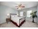 Inviting bedroom with a decorative ceiling fan, natural light, and a comfortable bed at 7002 Oakbay Cir, Noblesville, IN 46062