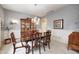 Formal dining room with an elegant chandelier, large china cabinet, and stylish decor at 7002 Oakbay Cir, Noblesville, IN 46062