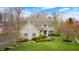 Charming two-story home with light siding, lovely landscaping, and a welcoming front entrance at 7002 Oakbay Cir, Noblesville, IN 46062