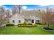 Two-story home featuring lush landscaping, a manicured lawn, and timeless architectural elements, exudes curb appeal at 7002 Oakbay Cir, Noblesville, IN 46062