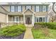 Charming two-story home with a welcoming front porch, manicured landscaping, and classic architectural details at 7002 Oakbay Cir, Noblesville, IN 46062