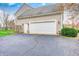 A two-car garage with a clean driveway and well-maintained exterior showcases practicality and curb appeal at 7002 Oakbay Cir, Noblesville, IN 46062