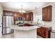 Kitchen features granite counters, stainless appliances, and a kitchen island at 7002 Oakbay Cir, Noblesville, IN 46062