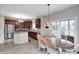 Eat-in kitchen features granite counters, stainless appliances, and dark wood cabinetry at 7002 Oakbay Cir, Noblesville, IN 46062