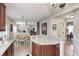 Kitchen island features granite countertops, dark wood cabinetry, and an open floor plan at 7002 Oakbay Cir, Noblesville, IN 46062