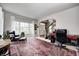 Comfortable living room with large window, fireplace view, and traditional furnishings at 7002 Oakbay Cir, Noblesville, IN 46062