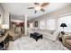 Open-concept living room with view to kitchen, neutral decor, and comfortable furnishings at 7002 Oakbay Cir, Noblesville, IN 46062