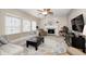 Spacious living room with fireplace, plush seating, and plenty of natural light at 7002 Oakbay Cir, Noblesville, IN 46062