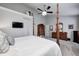 Bright primary bedroom with a large bed, tv and and dressers at 7002 Oakbay Cir, Noblesville, IN 46062