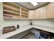 Office space featuring ample storage with wood cabinets, countertops, and overhead lighting at 7002 Oakbay Cir, Noblesville, IN 46062