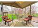 Relaxing screened porch with comfortable seating and scenic backyard views offers an inviting outdoor space at 7002 Oakbay Cir, Noblesville, IN 46062
