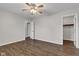 Comfortable bedroom with ceiling fan, wood-look floors, and easy access to closets at 720 Danielle Rd, Lebanon, IN 46052