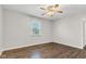 Light-filled bedroom with a ceiling fan and window, ready for relaxation and rest at 720 Danielle Rd, Lebanon, IN 46052