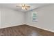 Bright bedroom with wood-look floors and a ceiling fan for added comfort at 720 Danielle Rd, Lebanon, IN 46052