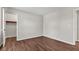 Neutral bedroom featuring wood-look floors and convenient access to a closet at 720 Danielle Rd, Lebanon, IN 46052
