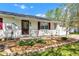 Charming home with a well-manicured garden bed and inviting front porch at 720 Danielle Rd, Lebanon, IN 46052
