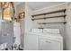 Practical laundry area with washer, dryer and shelving units at 720 Danielle Rd, Lebanon, IN 46052