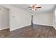 Spacious living room with wood-look floors and a ceiling fan, ready for comfortable living at 720 Danielle Rd, Lebanon, IN 46052