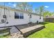 Outdoor patio area adjacent to a white home, providing a perfect space for entertaining and relaxation at 720 Danielle Rd, Lebanon, IN 46052