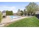 Spacious backyard with a swimming pool, patio furniture, and lush green grass at 7259 Josiah Ct, Indianapolis, IN 46259
