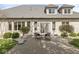 Brick home with a charming patio and outdoor seating, perfect for enjoying the serene backyard view at 7259 Josiah Ct, Indianapolis, IN 46259