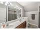 Clean bathroom with double sink vanity and shower-tub combo at 7259 Josiah Ct, Indianapolis, IN 46259