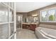 Luxurious bathroom with a soaking tub, walk-in shower, and double vanity sinks at 7259 Josiah Ct, Indianapolis, IN 46259