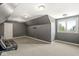 Attic bonus room with TV mount, carpet flooring, and natural light at 7259 Josiah Ct, Indianapolis, IN 46259