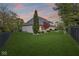 Back of home overlooking a large, lush green lawn and mature trees at 7259 Josiah Ct, Indianapolis, IN 46259