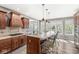 Kitchen with custom range hood, large island and stainless steel appliances at 7259 Josiah Ct, Indianapolis, IN 46259