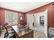 Home office with large desk, natural light and view to the exterior at 7259 Josiah Ct, Indianapolis, IN 46259