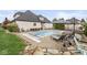 Backyard pool with lounge chairs and patio, perfect for outdoor relaxation and entertaining at 7259 Josiah Ct, Indianapolis, IN 46259
