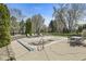 Fenced backyard featuring a swimming pool, lush trees, and an outdoor dining area at 7259 Josiah Ct, Indianapolis, IN 46259