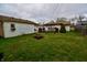 Spacious backyard with green grass, a fire pit, and room for outdoor activities at 7367 Parkside Dr, Indianapolis, IN 46226