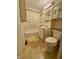 Bathroom featuring a toilet, vanity, bathtub, shower, and built in storage at 7367 Parkside Dr, Indianapolis, IN 46226