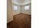Cozy bedroom featuring soft carpeting and natural light from two windows at 7367 Parkside Dr, Indianapolis, IN 46226
